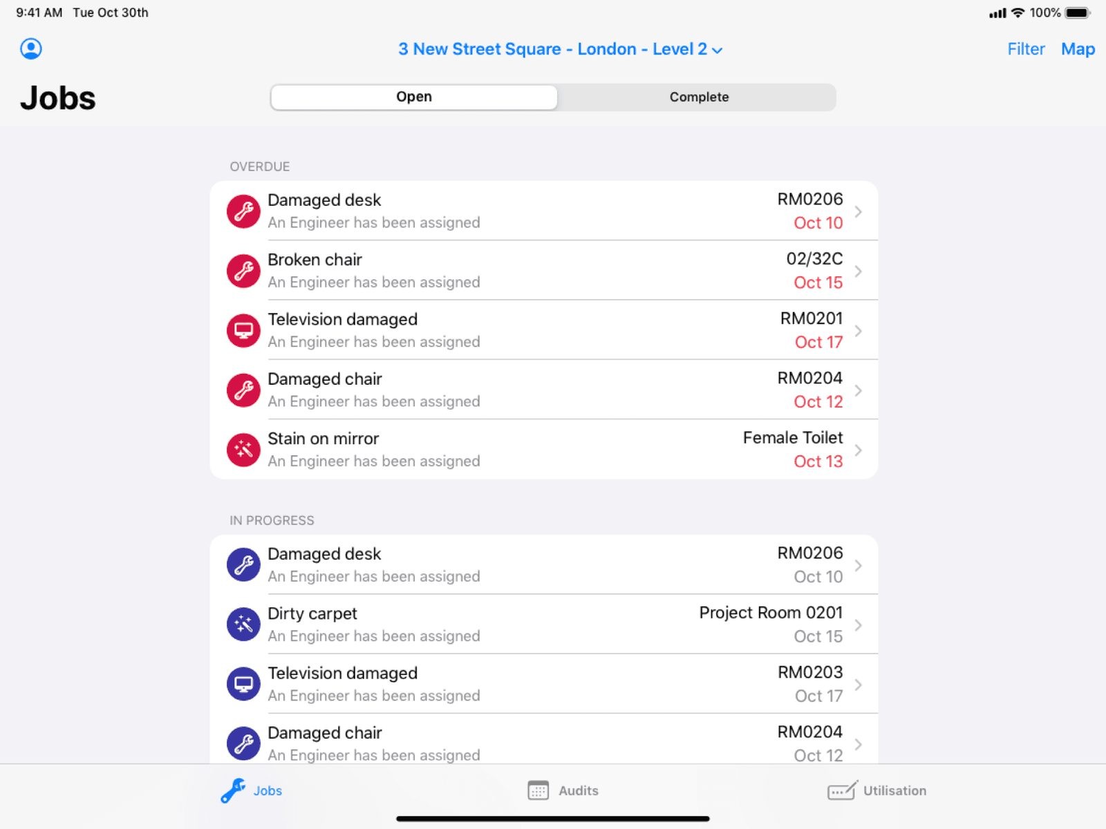 The Workplace app's Jobs list, showing maintenance issues like a damaged desk or broken chair.
